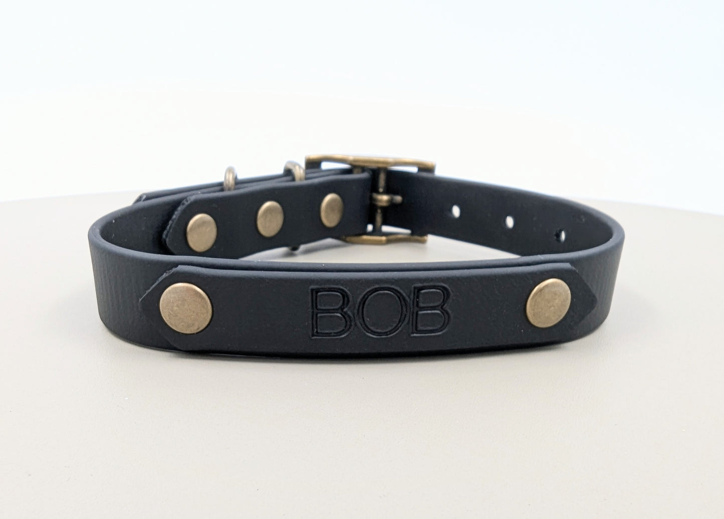 A heat stamped biothane personalized plate for dog collars and leads