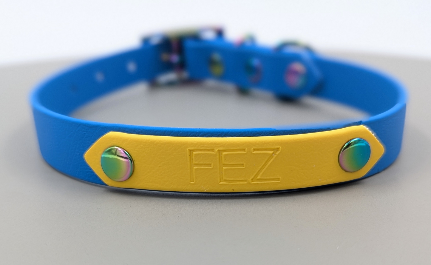 A heat stamped biothane personalized plate for dog collars and leads