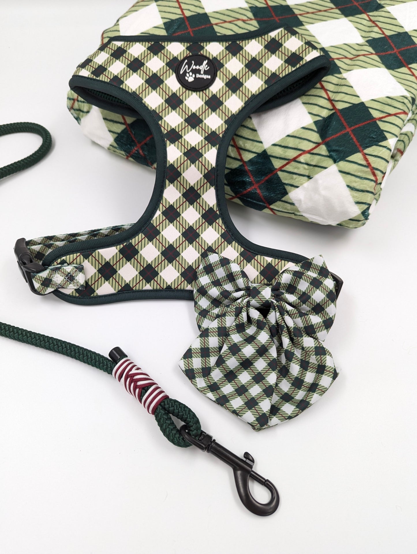 Checkered dog harness with brand logo on a white background designed in ireland emerald hearth tartan argyle dog harness adjustable plaid designbest quality dark green crimson dog bow collar and lead handmade dog accessories 