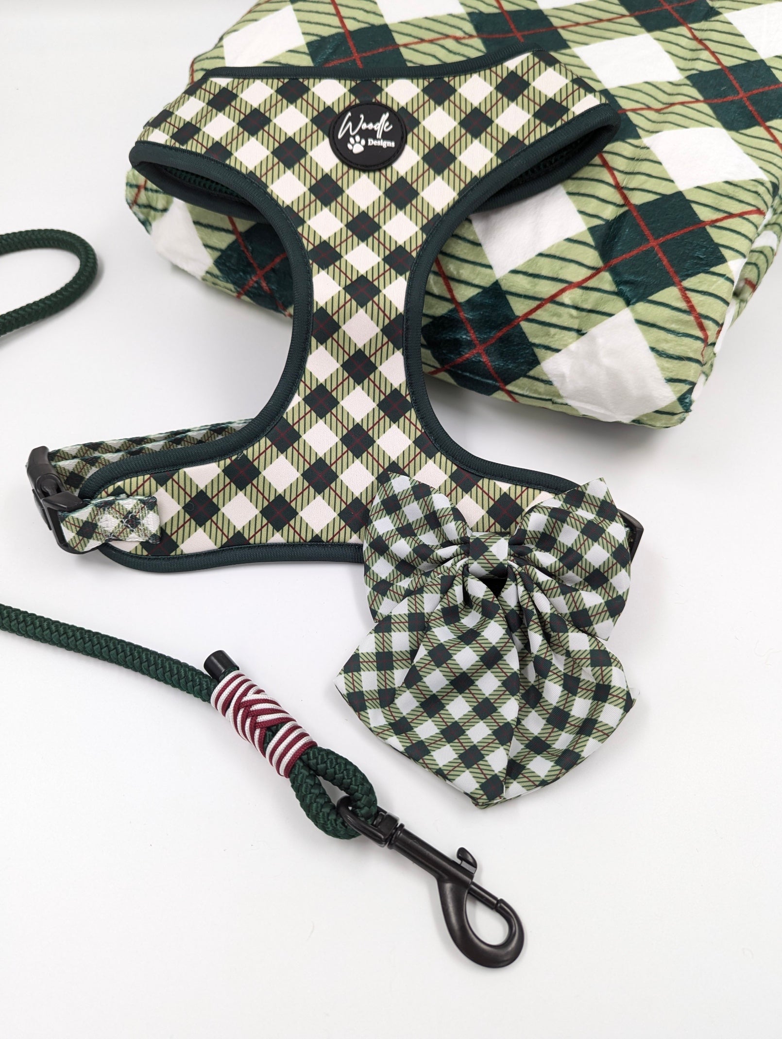 Checkered dog harness with brand logo on a white background designed in ireland emerald hearth tartan argyle dog harness adjustable plaid designbest quality dark green crimson dog bow collar and lead handmade dog accessories 