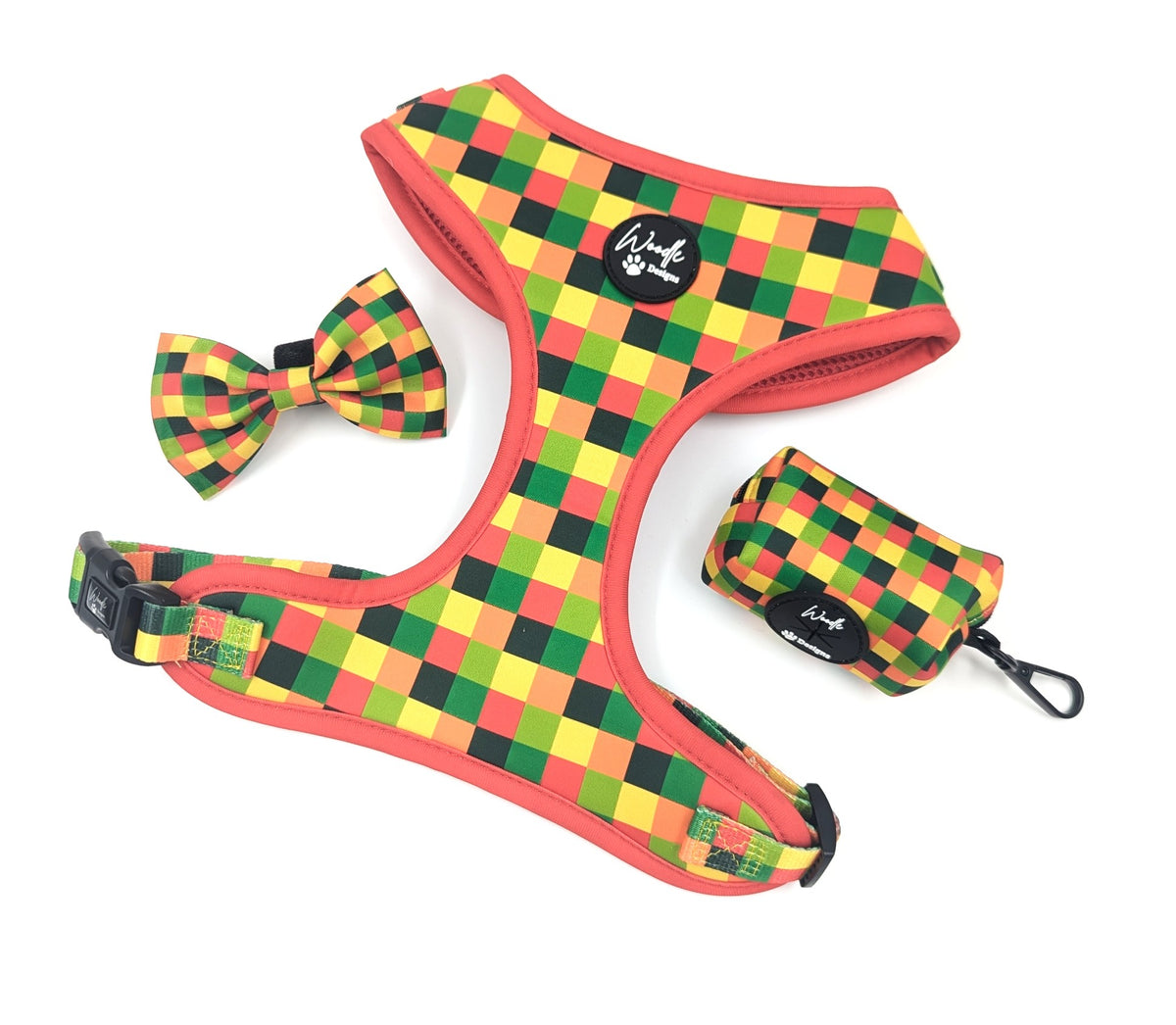 An adjustable dog harness set with a matching bow tie and small pouch, featuring a colorful checkered pattern in red, yellow, green, and black on a white background. Ireland UK and worldwide. 