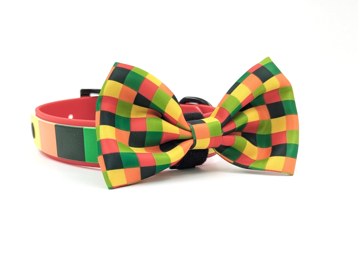 A handmade BioThane dog collar with a matching dog bow tie, featuring a vibrant red, green, yellow, and black checkered pattern. Ireland and worldwide. fast shipping.